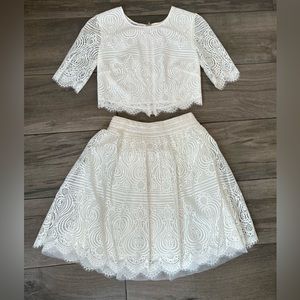 Bebe White two piece crop top with skirt.